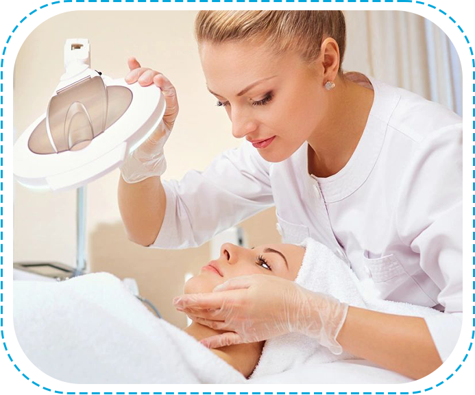 A woman is getting her face cleaned by a nurse.